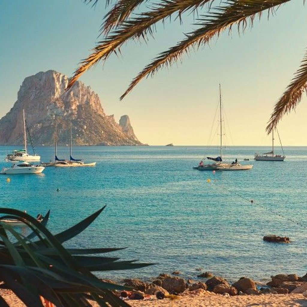 Cala d'Hort beach. Cala d'Hort in summer is extremely popular, beach have a fantastic view of the mysterious island of Es Vedra. Ibiza Island, Balearic Islands. Spain