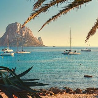 Cala d'Hort beach. Cala d'Hort in summer is extremely popular, beach have a fantastic view of the mysterious island of Es Vedra. Ibiza Island, Balearic Islands. Spain